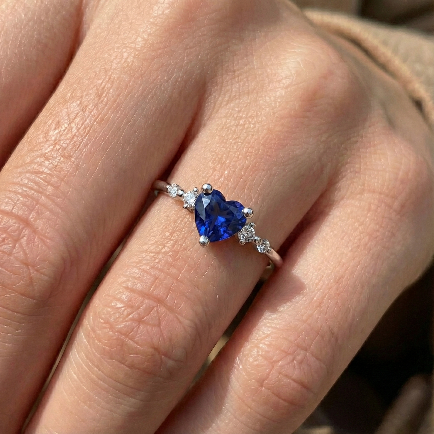 natural round sapphire 1.25ct ring on white background