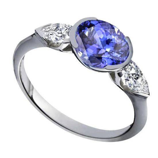 Sparkling 3-Stone 3 Carat Oval Tanzanite And Pear Diamond Ring