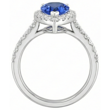 natural round tanzanite 12.25ct ring on white background