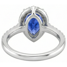 natural round tanzanite 12.25ct ring with diamond accents