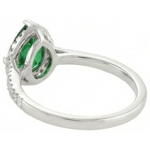 natural round emerald 4.50ct ring on white background