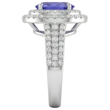 natural round tanzanite 5.25ct ring on white background