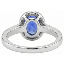 natural round tanzanite 5.60ct ring on white background