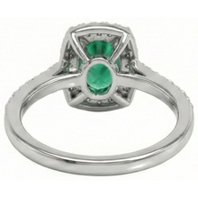 natural round emerald 5.75ct ring on white background
