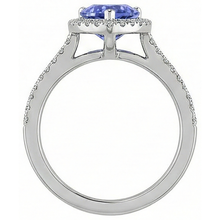 natural round tanzanite 5.75ct ring on white background
