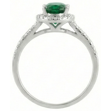 natural round emerald 6.75ct ring on white background