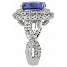 natural round tanzanite 7ct ring on white background