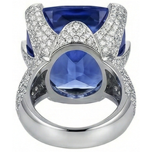 natural round tanzanite 8.50ct ring on white background