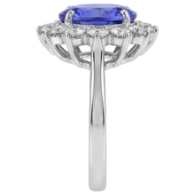 natural round tanzanite 5.25ct ring on white background