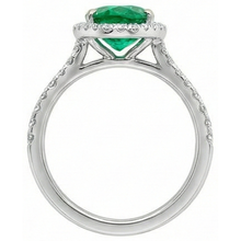 natural round emerald 5.25ct ring on white background