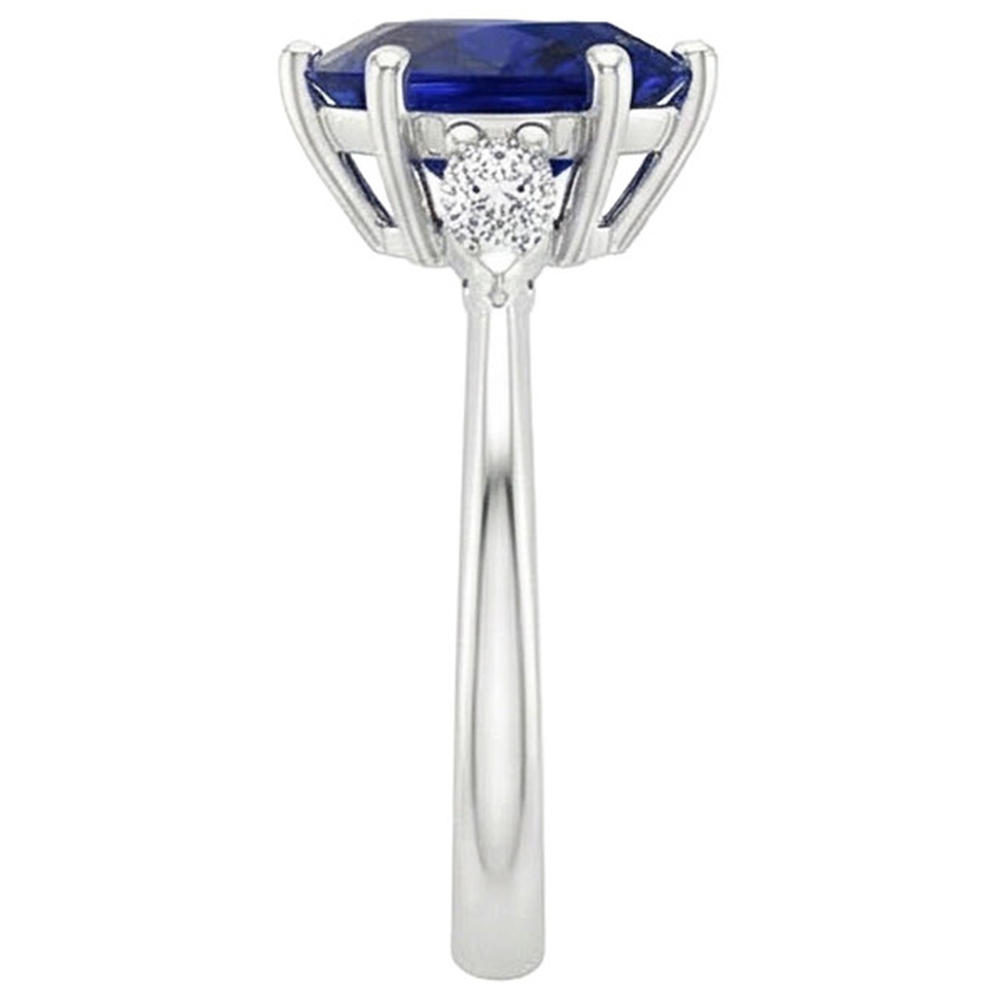 natural pear sapphire 3ct ring on white background