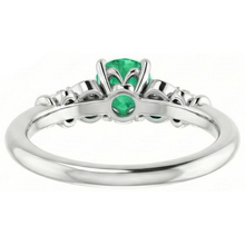 natural round emerald 1.40ct ring on white background
