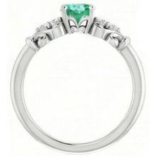 natural round emerald 1.40ct ring profile view