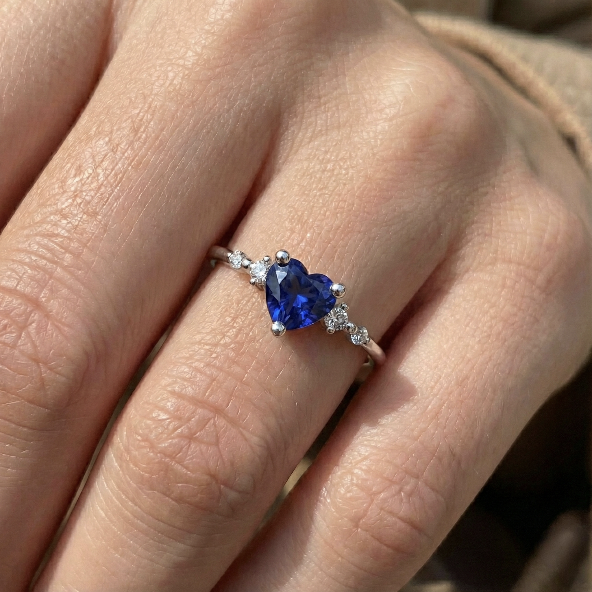 natural round sapphire 1.25ct ring on white background