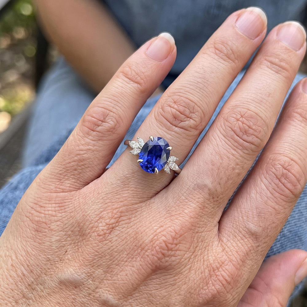 Oval Solitaire Blue Sapphire Ring With Pear Side Stones 4.50 Carats