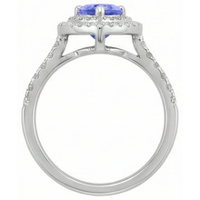 natural round tanzanite 5.25ct ring on white background