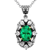 Oval Cut Colombian Emerald ring in 14K Two Tone Gold – main view