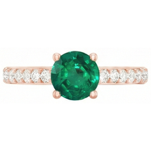 natural round emerald 2.50ct ring on white background