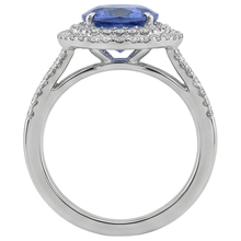natural round tanzanite 4.20ct ring on white background