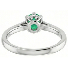natural round emerald 1.25ct ring on white background