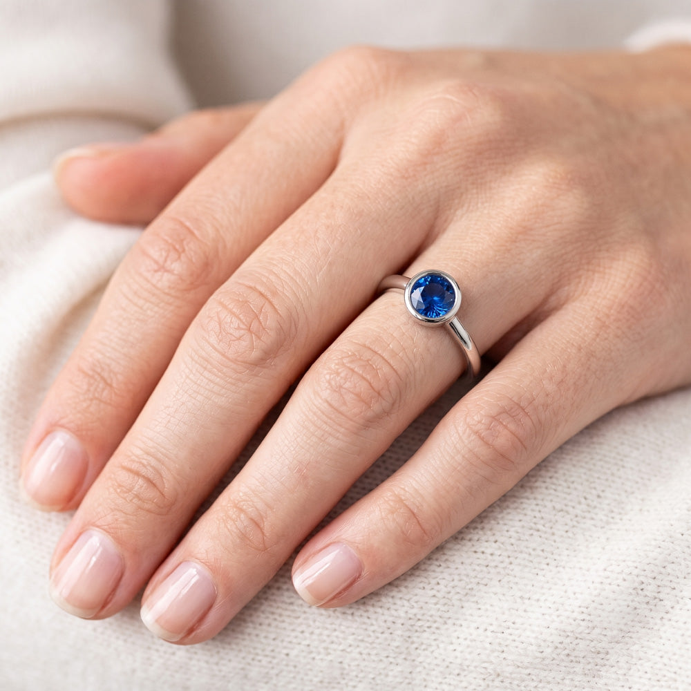 Solitaire Ring Blue Sapphire 0.75 Carats Bezel Setting White Gold 14K