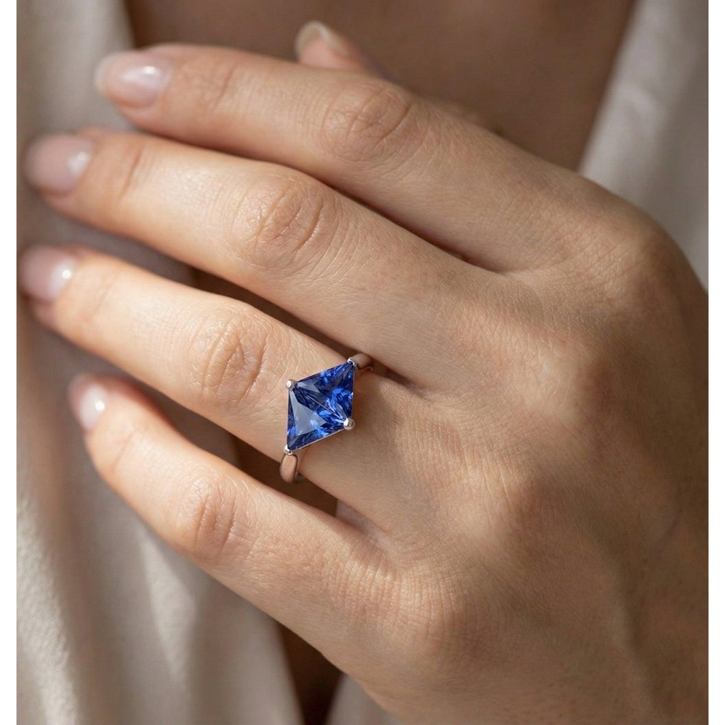 natural trillion sapphire 2ct ring on white background