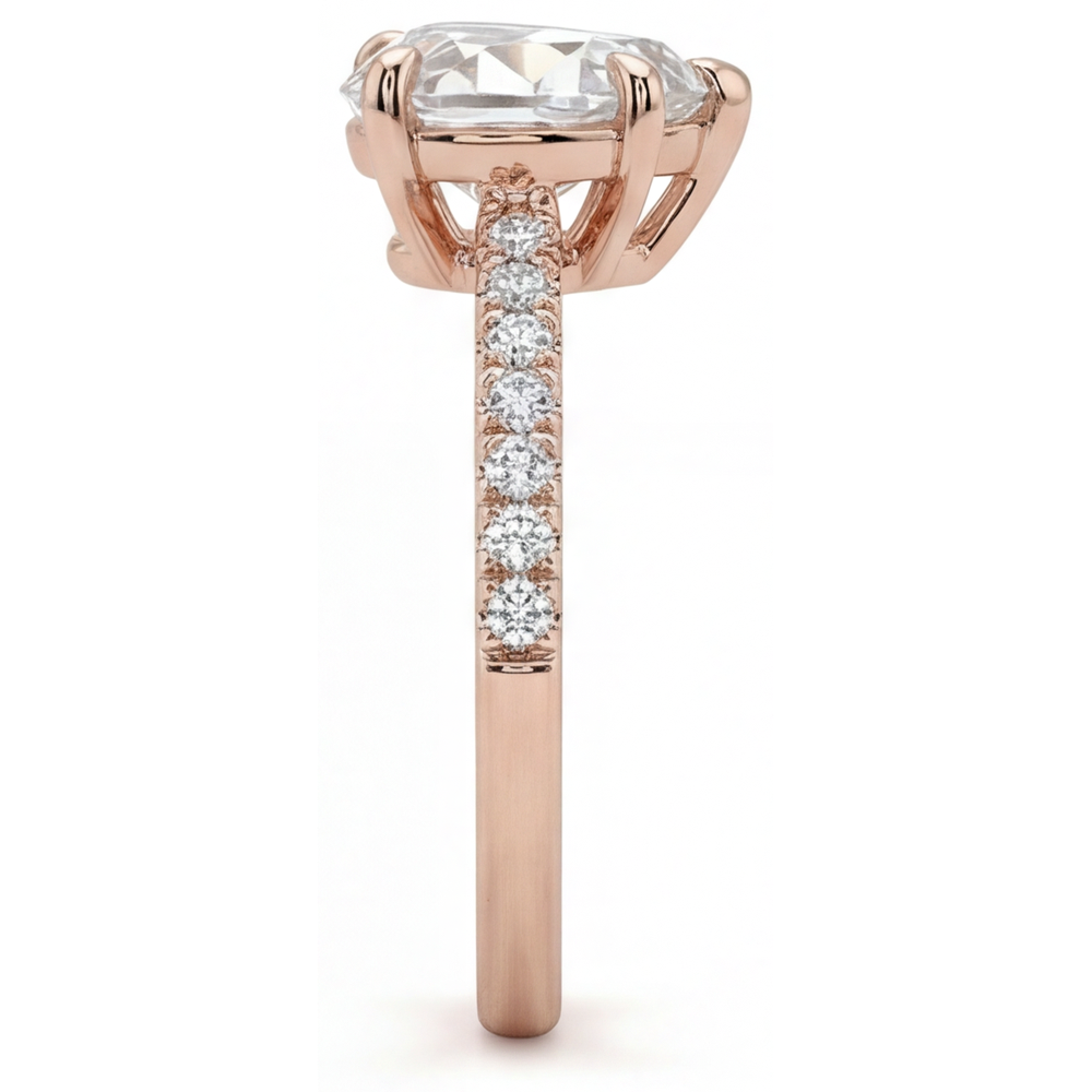 Diamond Heart Shape Solitaire with Side Stones in 14K Rose Gold – profile view