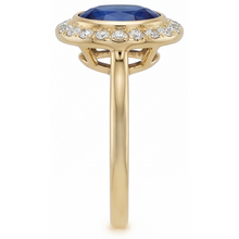 Oval Cut Royal Blue Sapphire ring in 14 Karat Yellow Gold – profile view