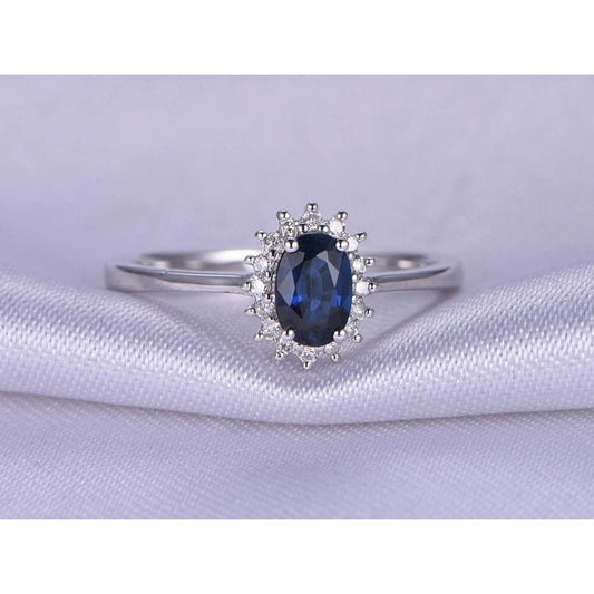 2.5 Carats Blue Oval Cut Sapphire And Diamond Ring White Gold 14K